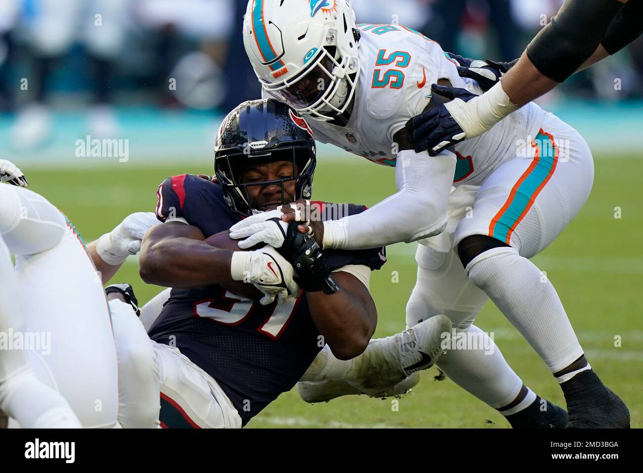 Miami Dolphins outside linebacker Jerome Baker (55) tackles