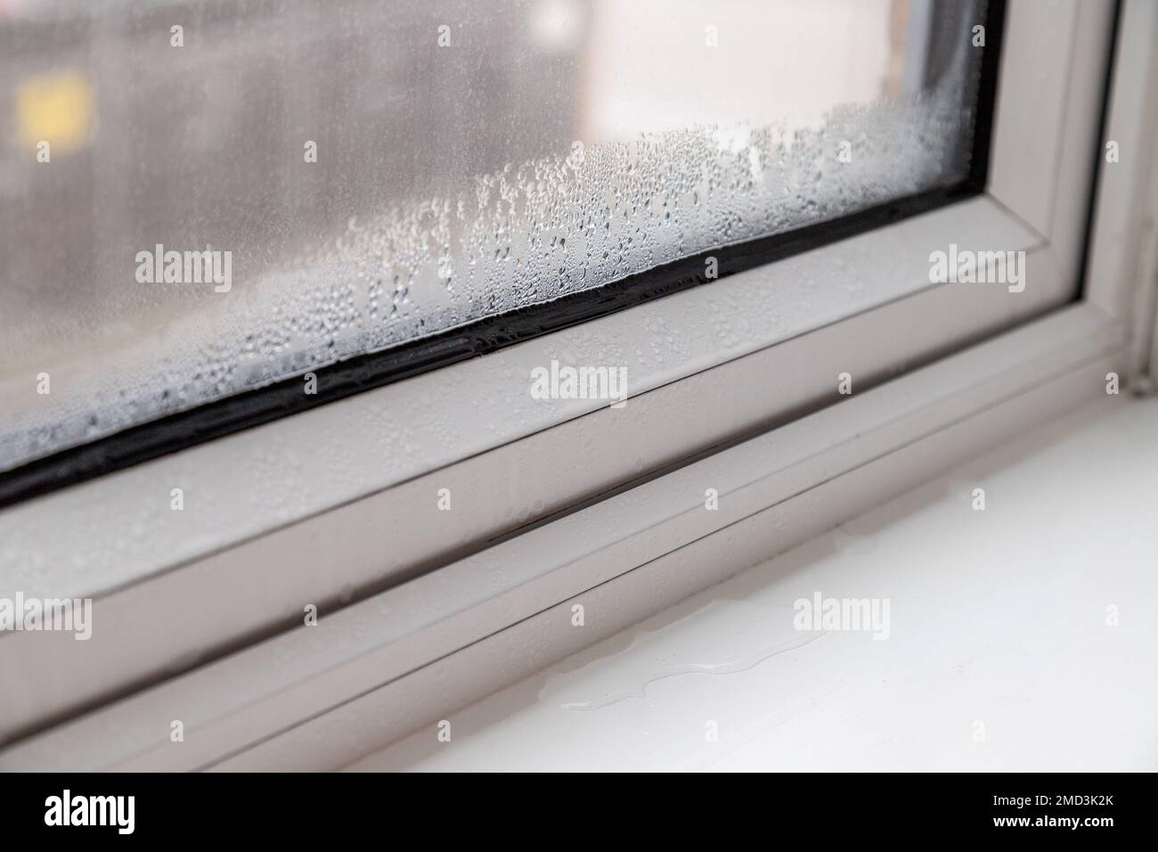 Closeup to condensation and water on the inside of modern upvc windows
