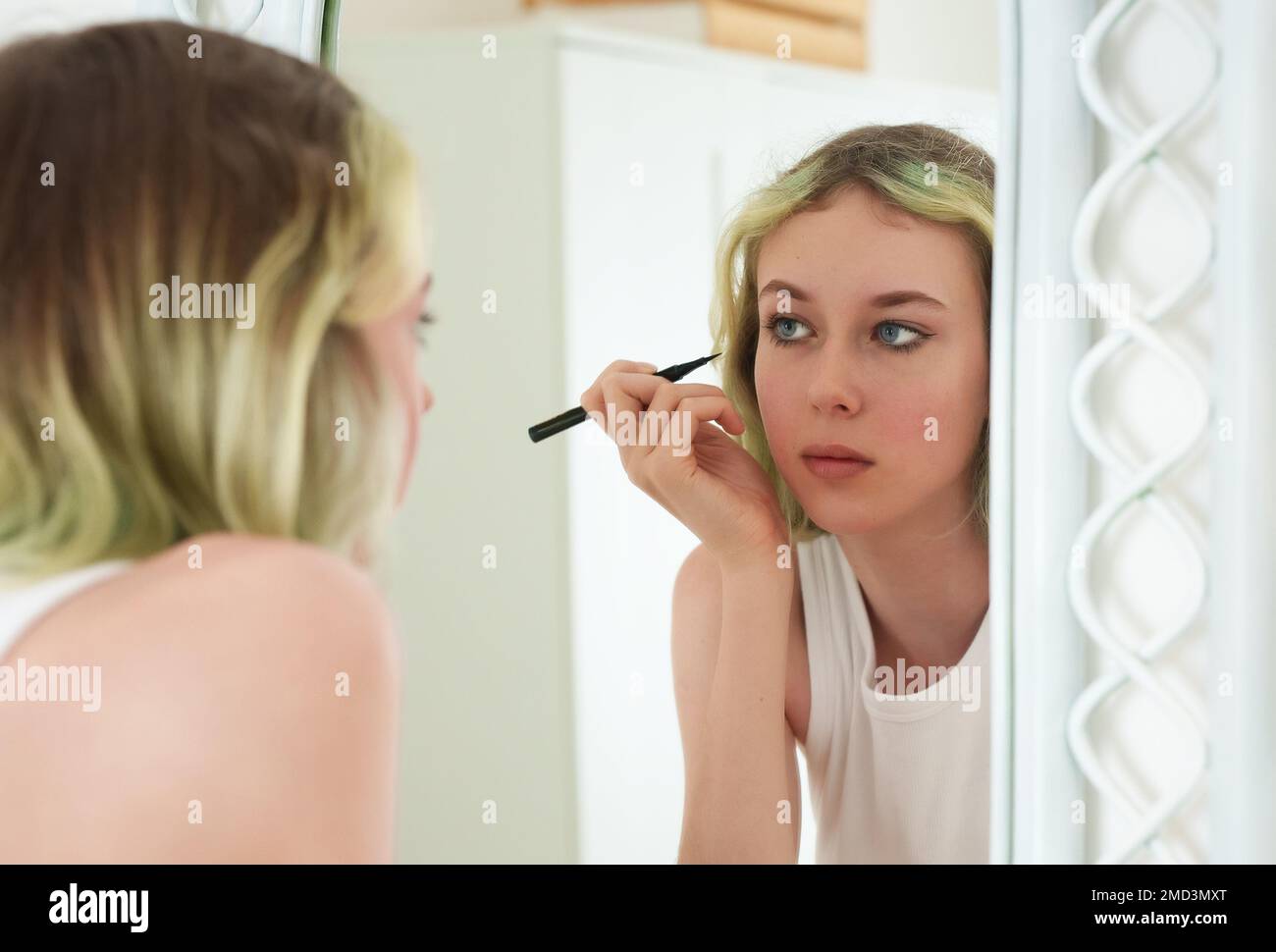 Teenage Girl Doing Makeup With Black Eyeliner Stock Photo Alamy Teenage girl doing makeup with black eyeliner stock photo alamy
