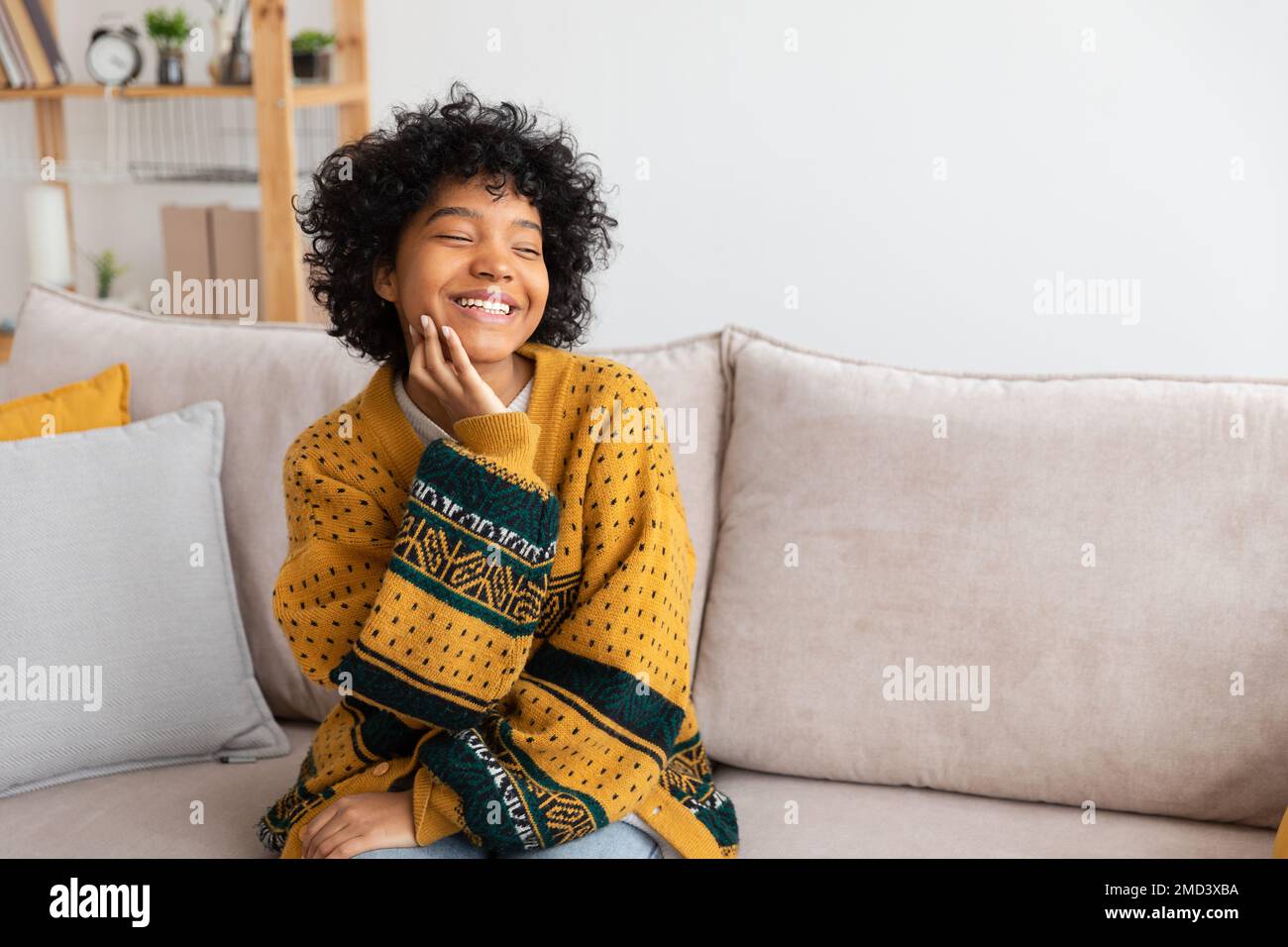 Beautiful african american girl with afro hairstyle smiling sitting on ...