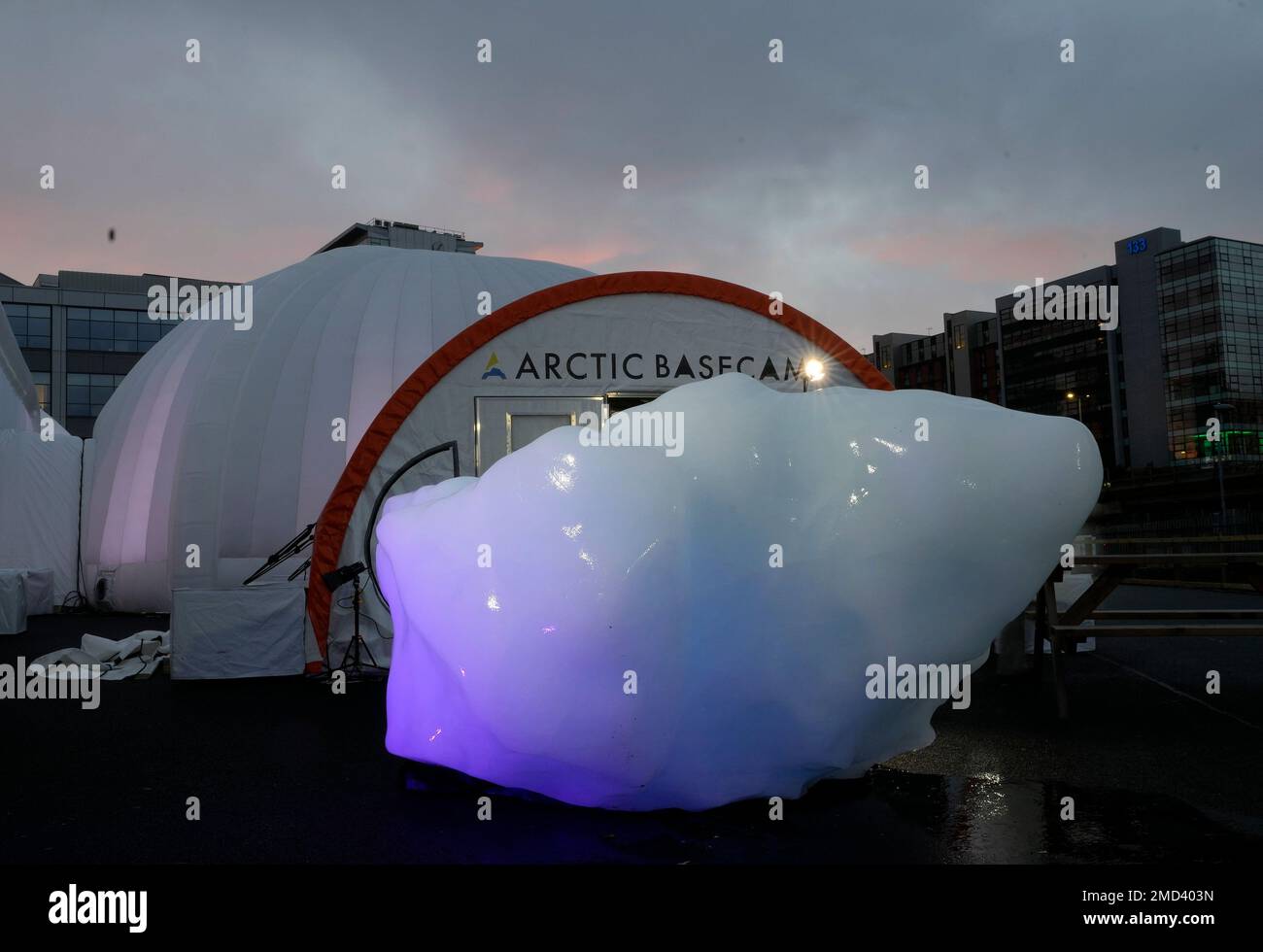 An iceberg delivered by members of Arctic Basecamp is placed on 