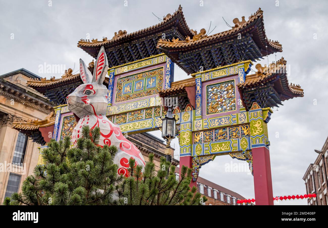 Rabbit sculpture seen under the Chinese paifang in the Chinatown district of Liverpool to mark the year of the rabbit in 2023. Stock Photo