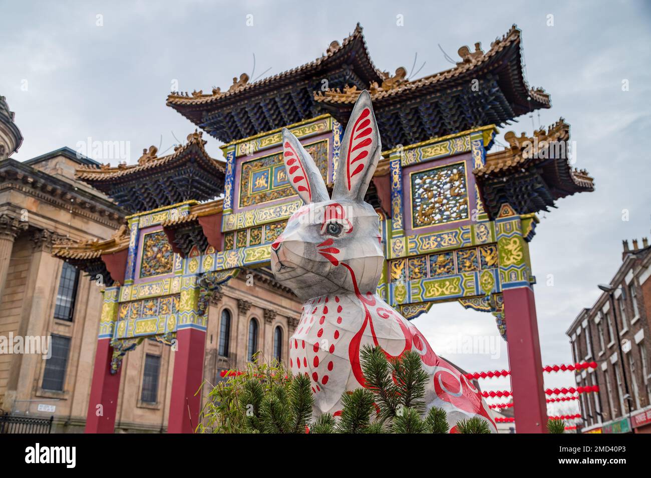 A rabbit sits under the paifang of Liverpools Chinatown during the Chinese New Year celebrations in January 2023. Stock Photo