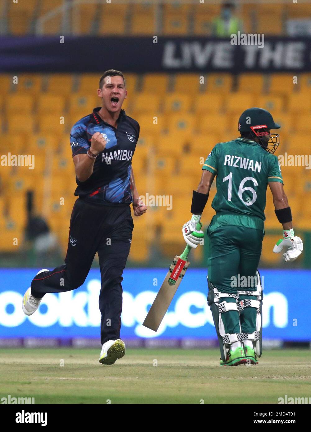Namibia's JJ Smit, left, celebrates before third umpire overturned the