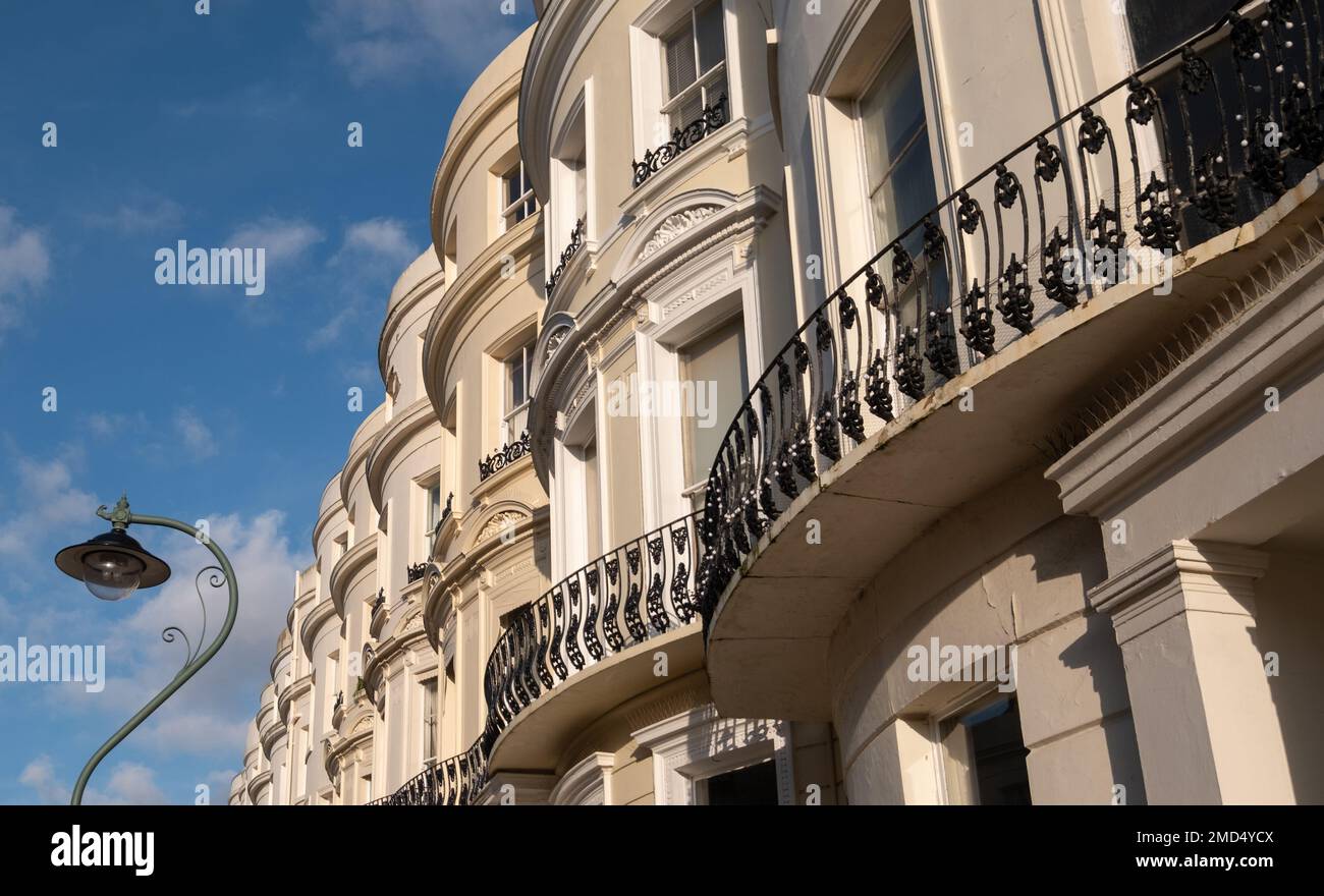 Attractive terraced properties in Lansdowne Place, Hove, East Sussex, UK. The stucco fronted