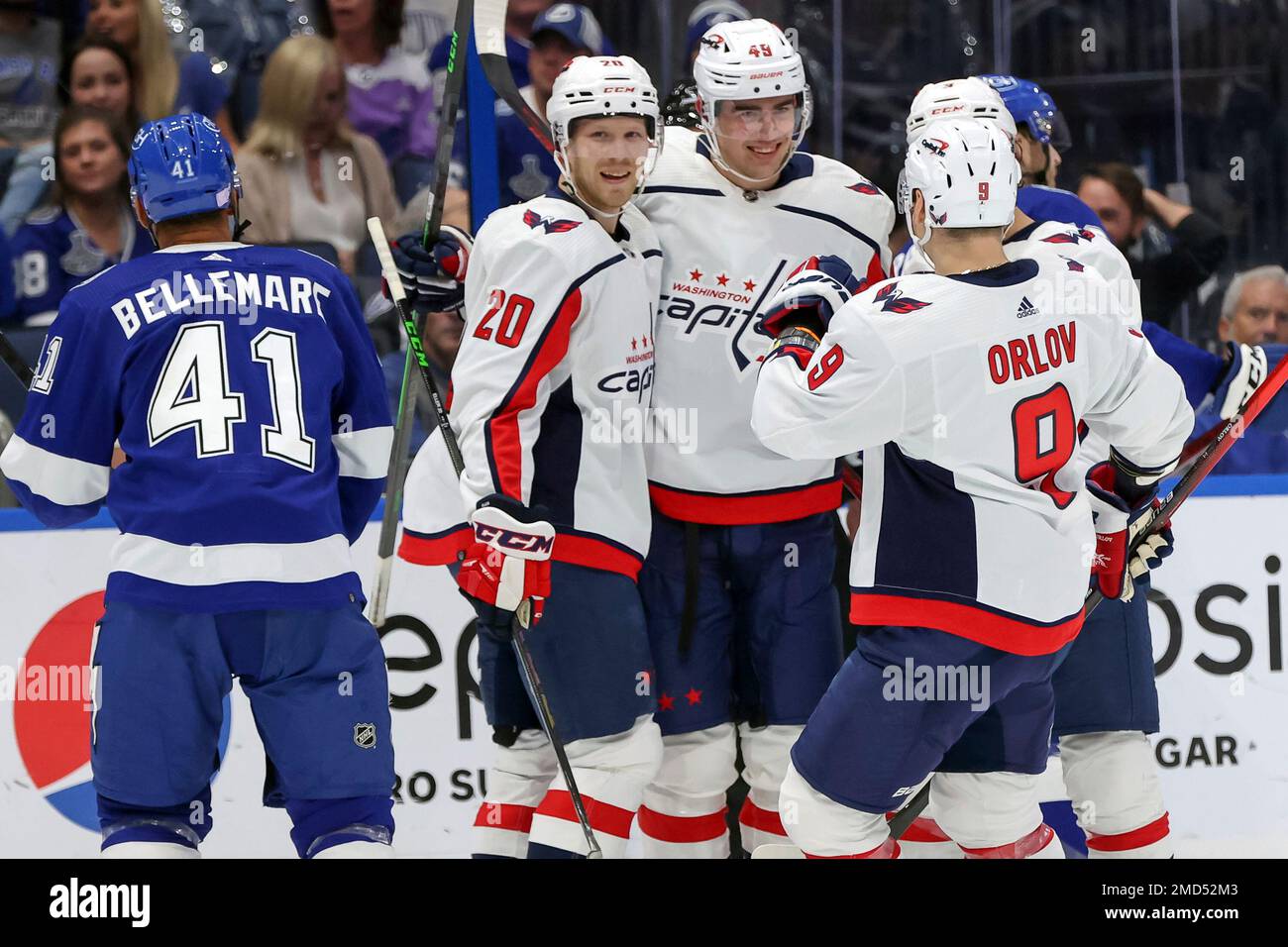 Washington Capitals' Brett Leason (49), is congratulated on his first