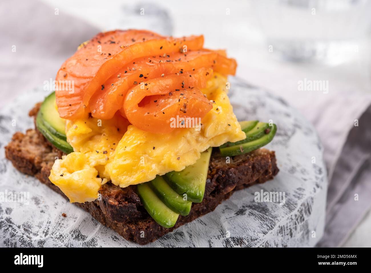 Scrambled eggs with smoked salmon and whole wheat toast Stock Photo - Alamy