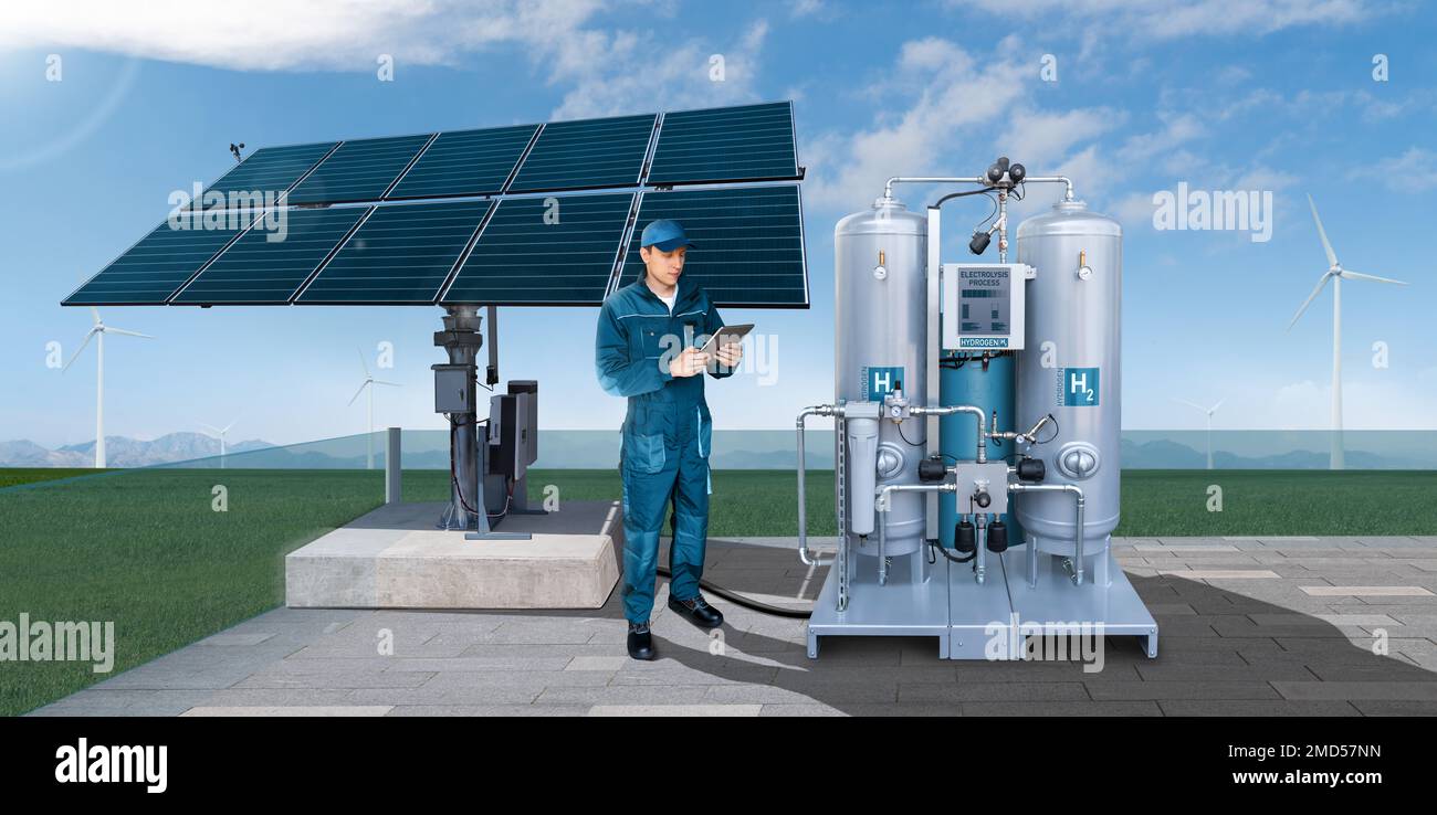 Engineer with tablet computer controls green hydrogen factory. Concept Stock Photo