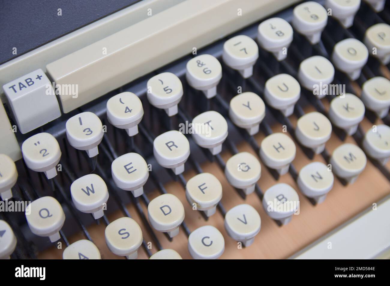 Closeup of the keyboard of an old mechanical typewriter with white keys and qwerty keyboard layout Stock Photo