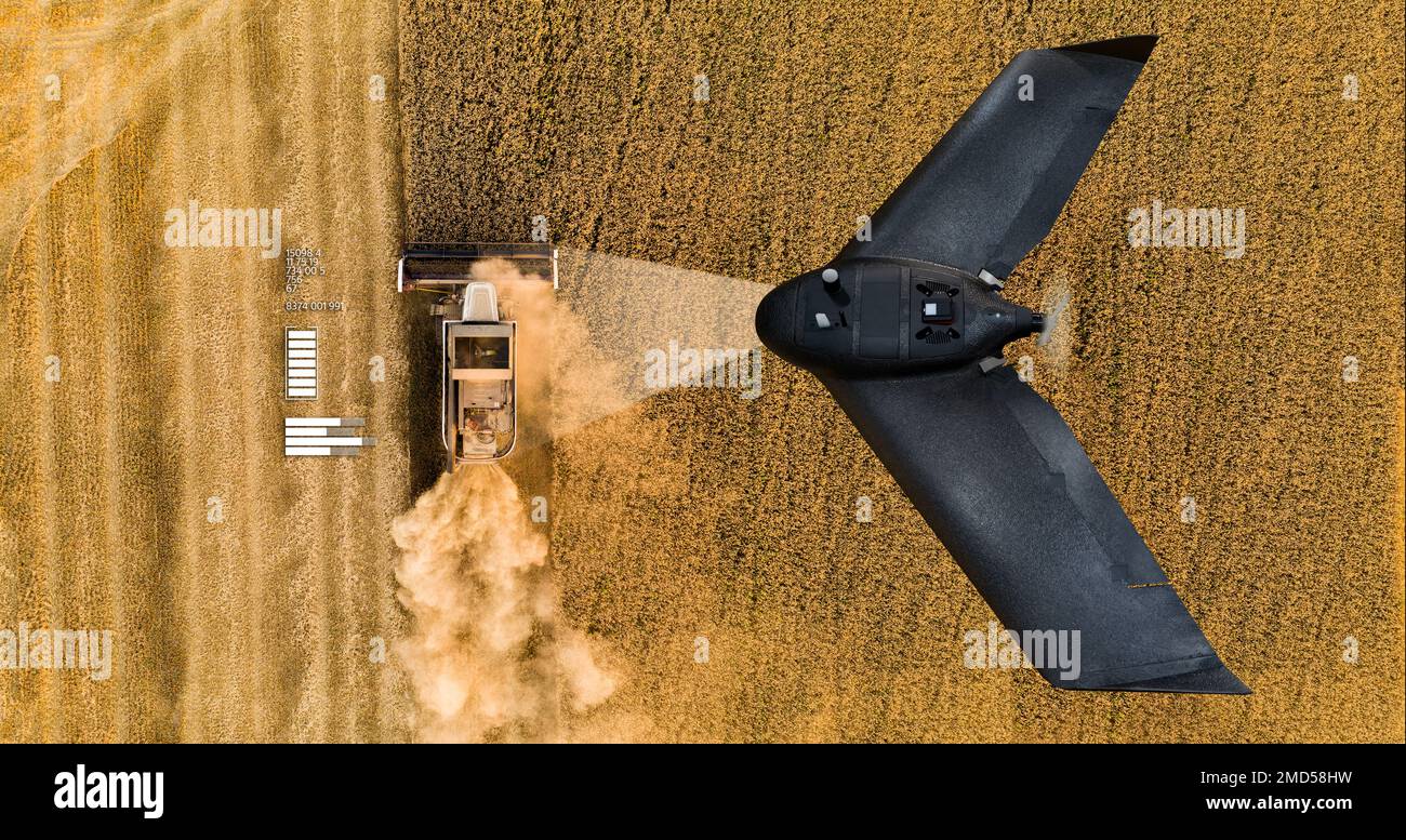Autonomous combine harvester and drone Stock Photo