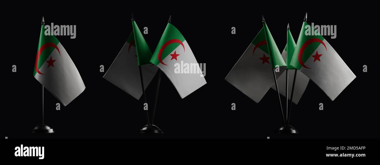 Small national flags of the Algeria on a black background. Stock Photo