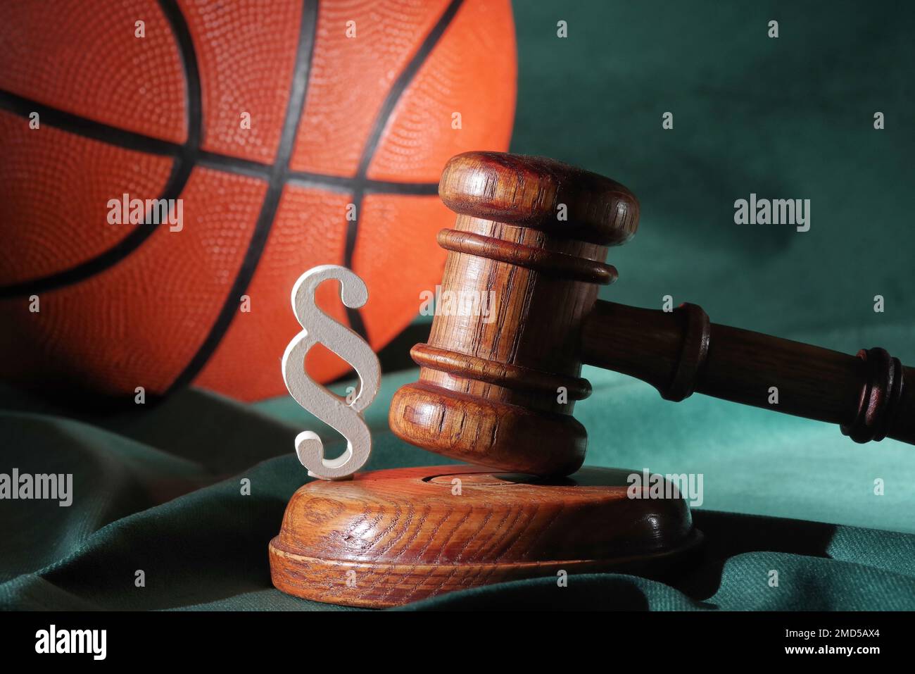 Sport and justice. Wooden judge gavel and basketball Stock Photo
