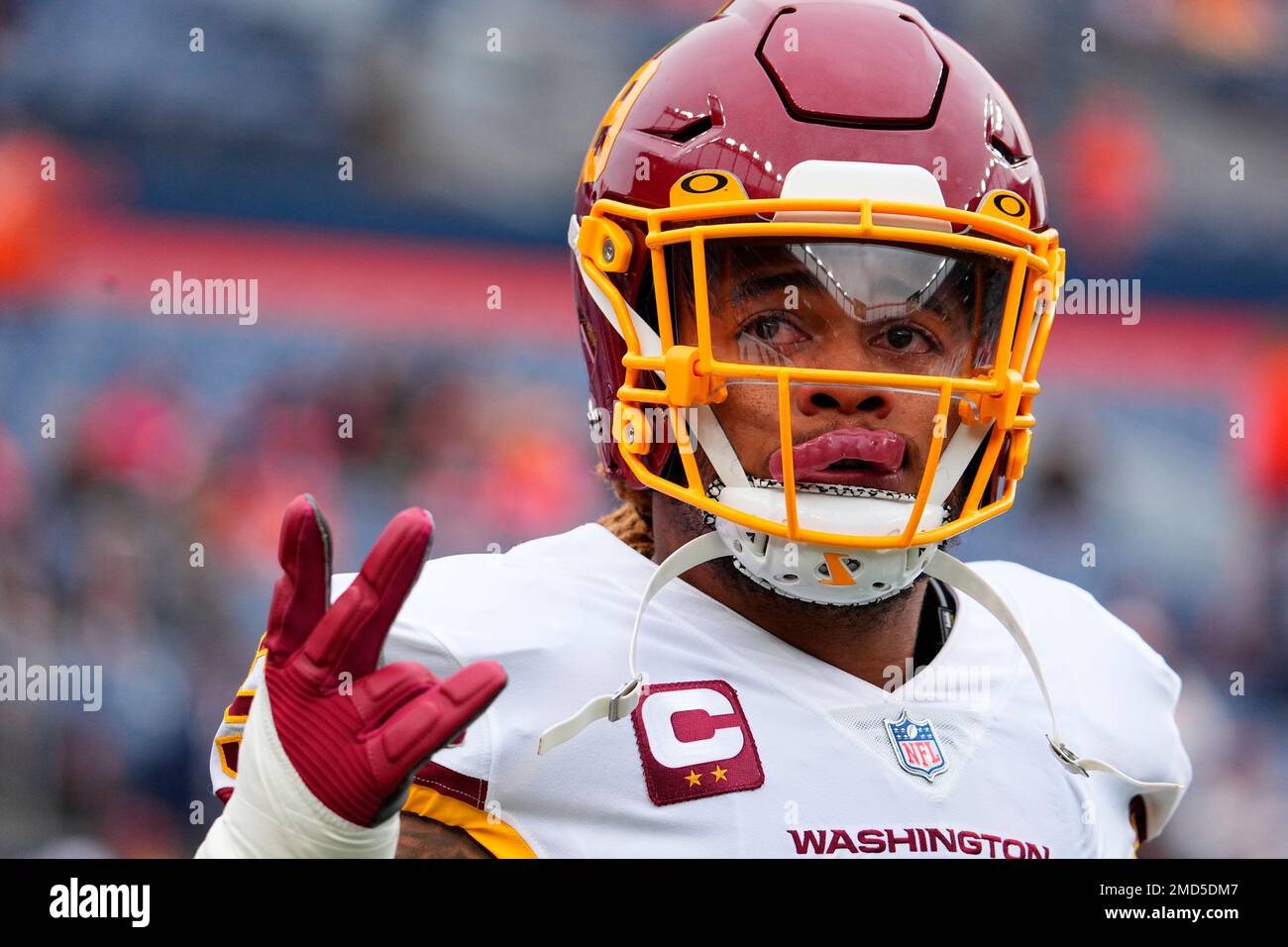 Washington Football Team defensive end Chase Young (99) warms up against  the Denver Broncos in the first half of an NFL football game Sunday, Oct.  31, 2021, in Denver. (AP Photo/Bart Young