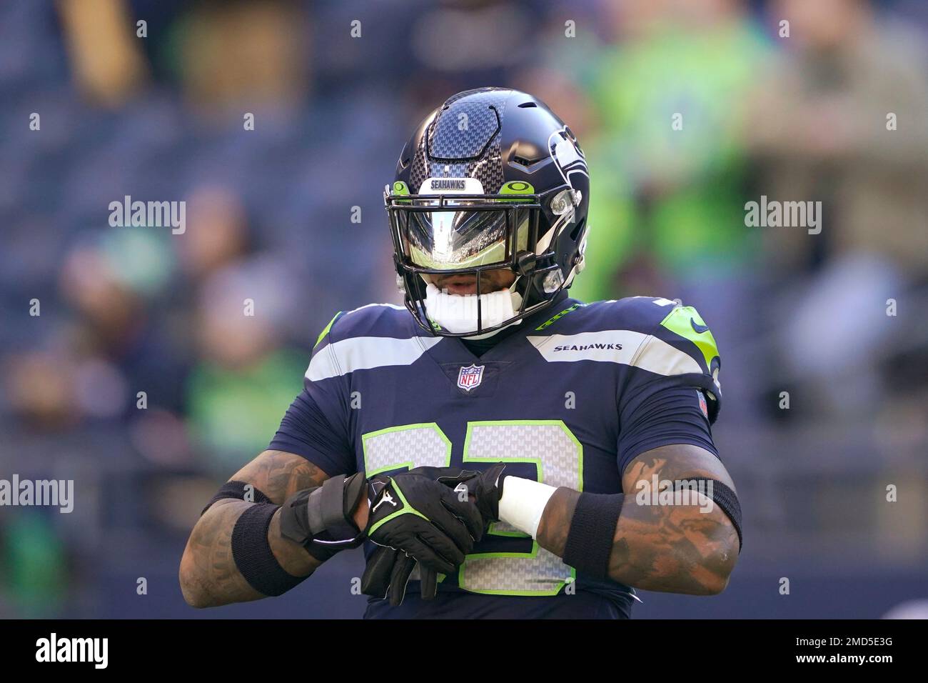 The stadium is reflected in the helmet visor of Seattle Seahawks' Jamal  Adams as he stands on the field before an NFL football game against the  Jacksonville Jaguars, Sunday, Oct. 31, 2021,