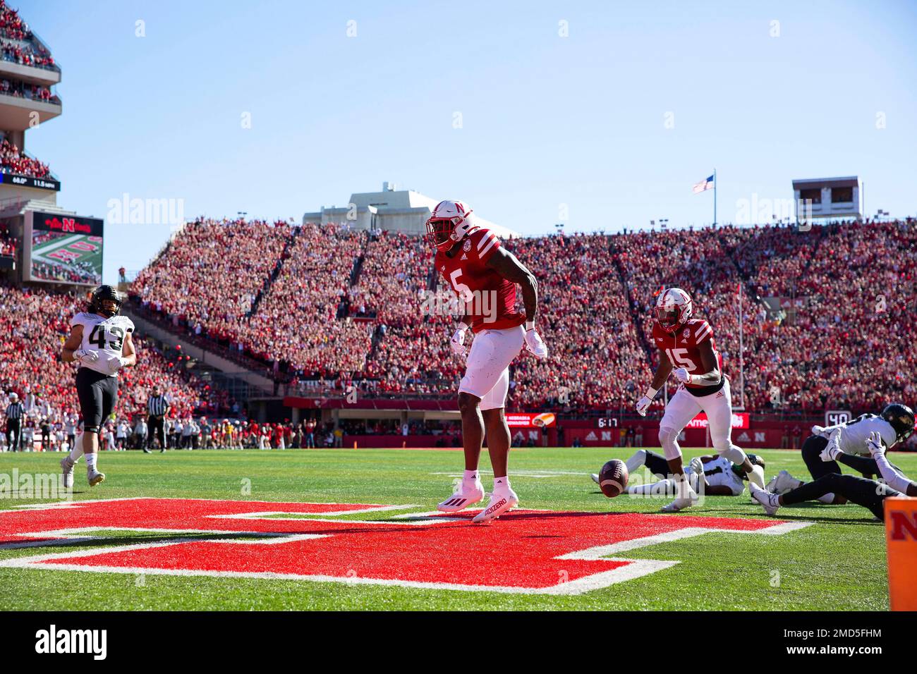 Nebraska wide receiver Omar Manning, left, scores a touchdown against