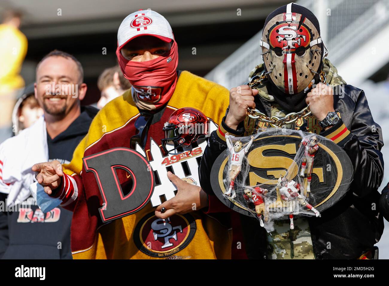 Fans dressed for Halloween watch warm ups prior to an NFL football game  between the Chicago Bears and San Francisco 49ers, Sunday, Oct. 31, 2021,  in Chicago. (AP Photo/Kamil Krzaczynski Stock Photo 