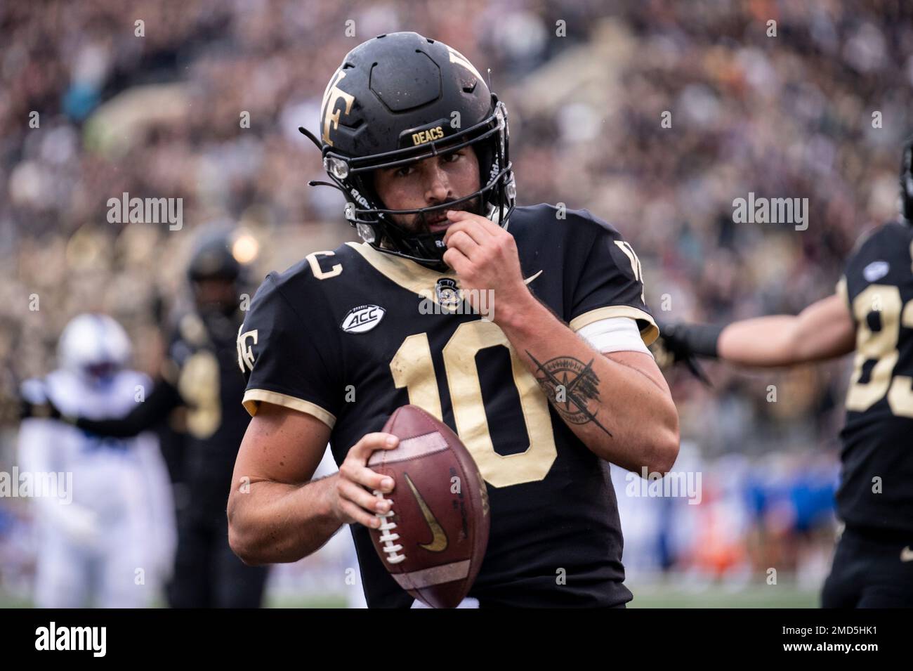Wake Forest quarterback Sam Hartman (10) scores a touchdown during the