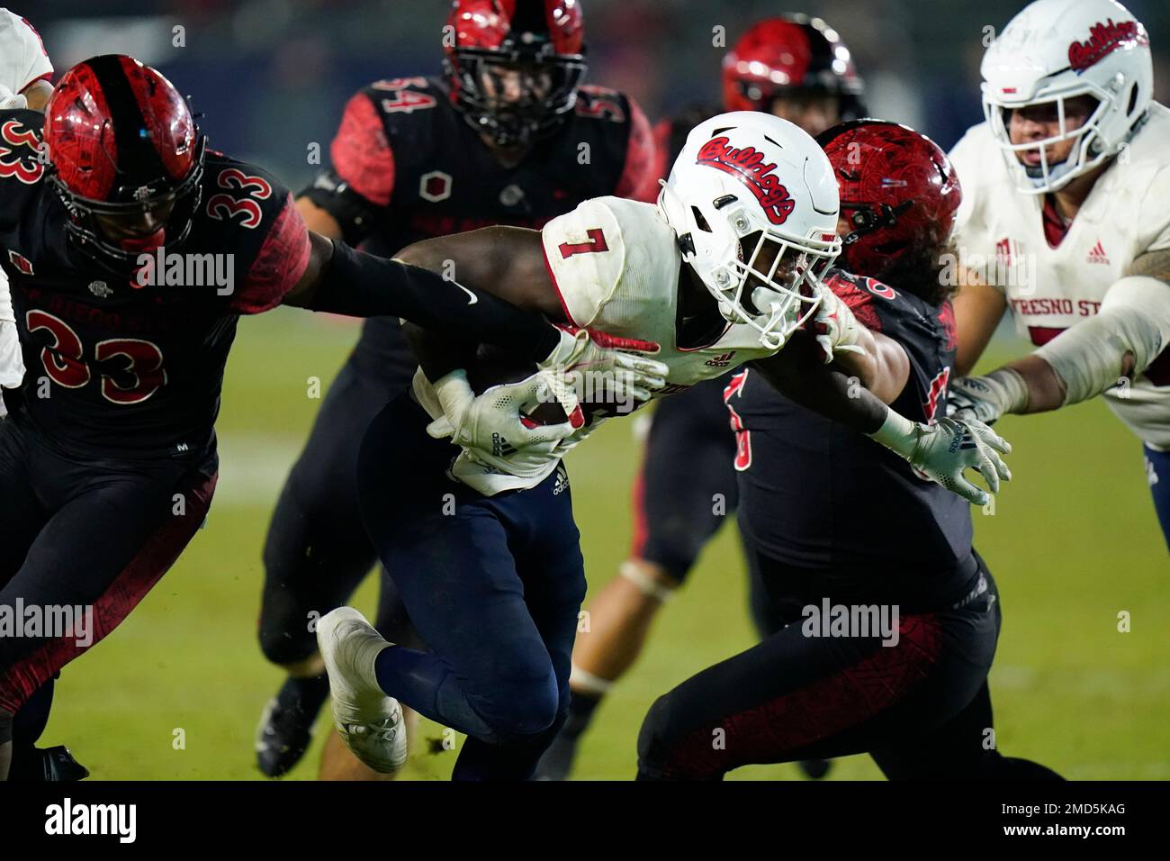Fresno State running back Jordan Mims, center, carries the ball toward