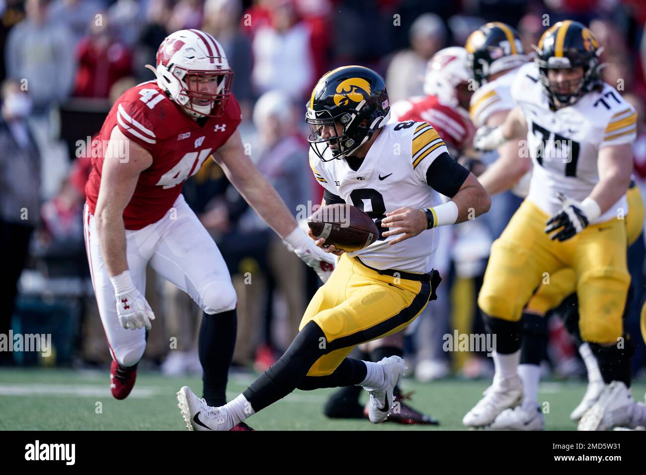 Iowa quarterback Alex Padilla (8) slides in as Wisconsin linebacker