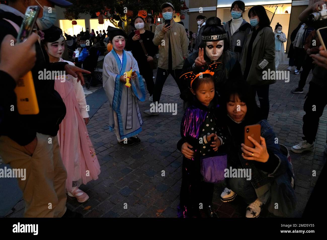 Residents dress up in costumes on the eve of Halloween at a shopping