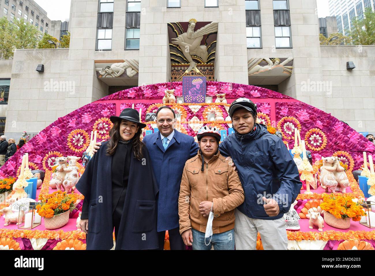 IMAGE DISTRIBUTED FOR TISHMAN SPEYER - Bertha Gonzalez, left, Co-Founder  and CEO of Tequila Casa Dragones, and Jorge Islas, second left, Consul  General of Mexico in New York, stand with delivery workers
