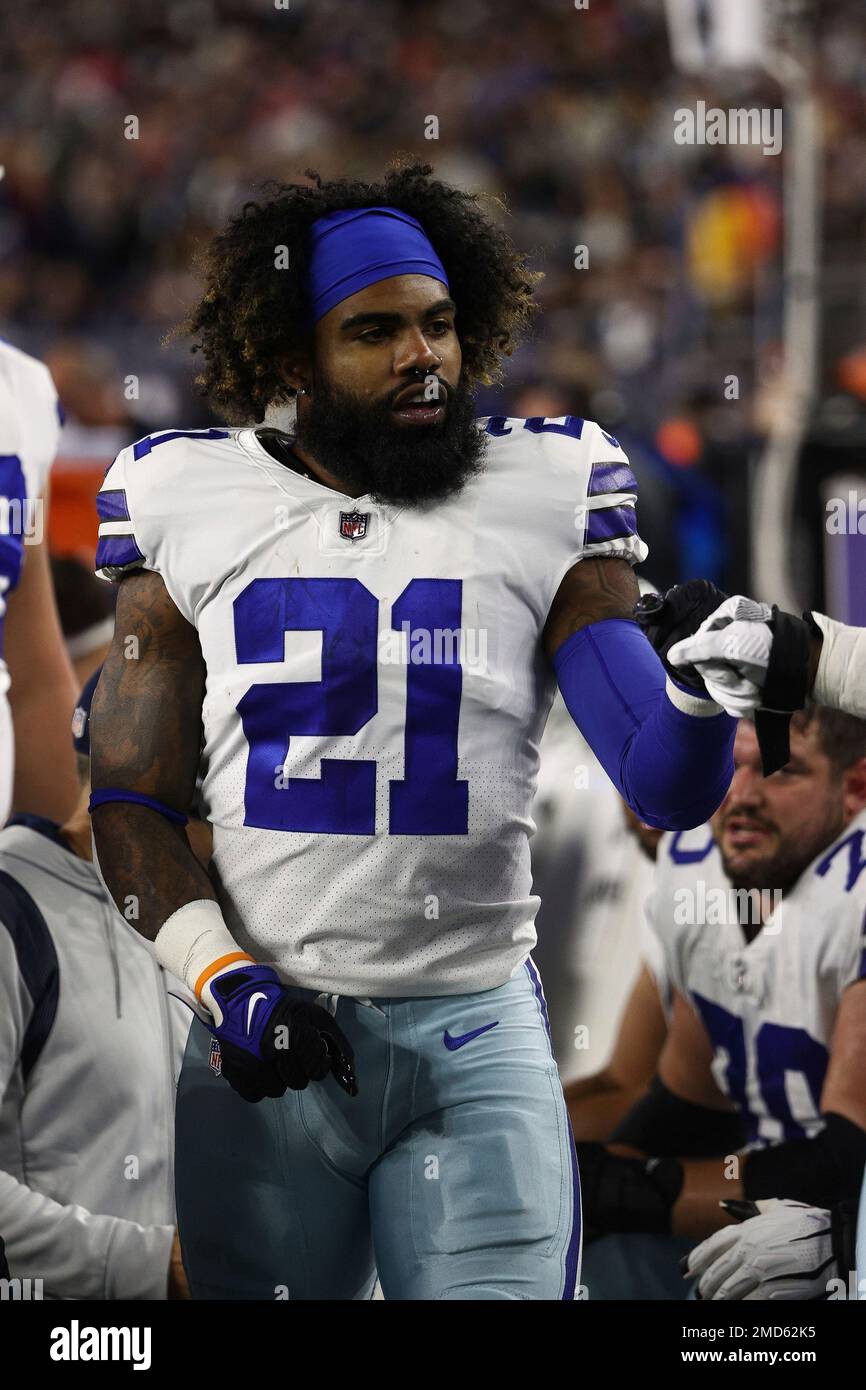 Dallas Cowboys' Ezekiel Elliott without his helmet on the bench during