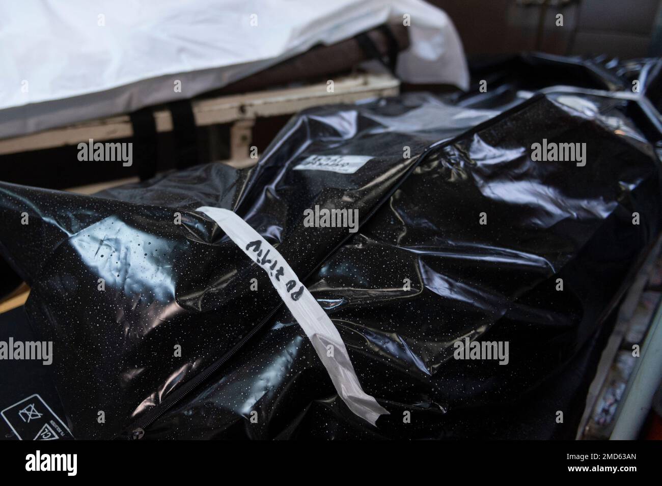 A body bag labeled "Positive" at the University Hospital morgue in  Bucharest, Romania, Friday, Oct. 29, 2021. Over the past weeks Romania  reported record numbers of daily new infections and deaths. (AP