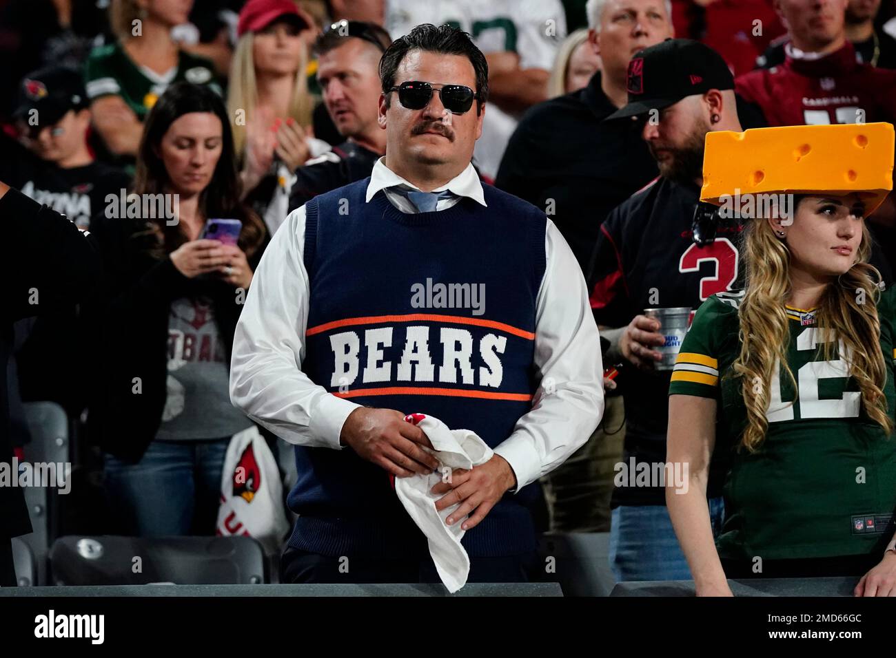 A fan dressed as legendary Chicago Bears coach Mike Ditka watches during  the second half of an NFL football game between the Green Bay Packers and  the Arizona Cardinals, Thursday, Oct. 28,