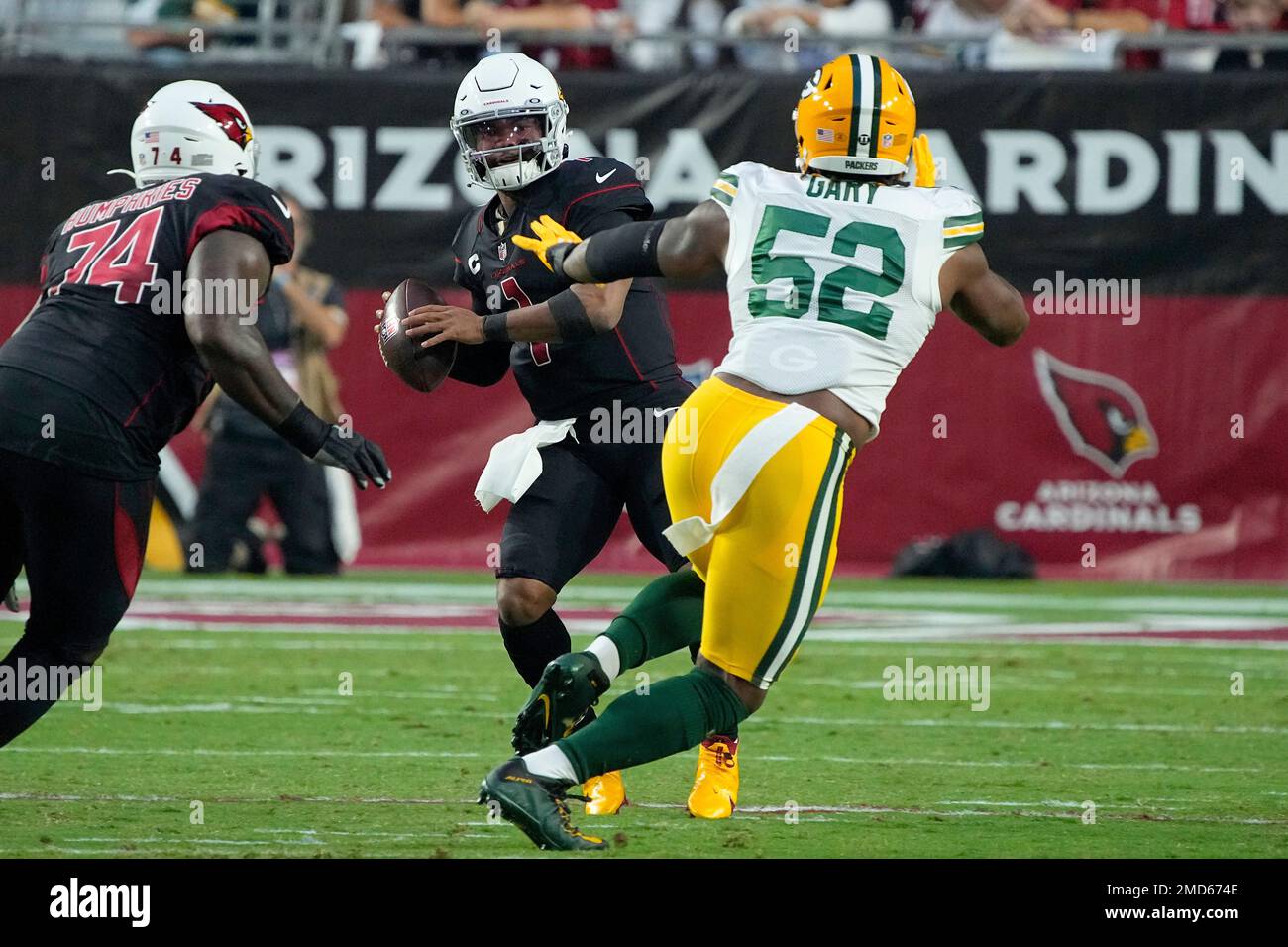 Arizona Cardinals quarterback Kyler Murray (1) throws under pressure from  Green Bay Packers outside linebacker Rashan Gary (52) during the first half  of an NFL football game, Thursday, Oct. 28, 2021, in