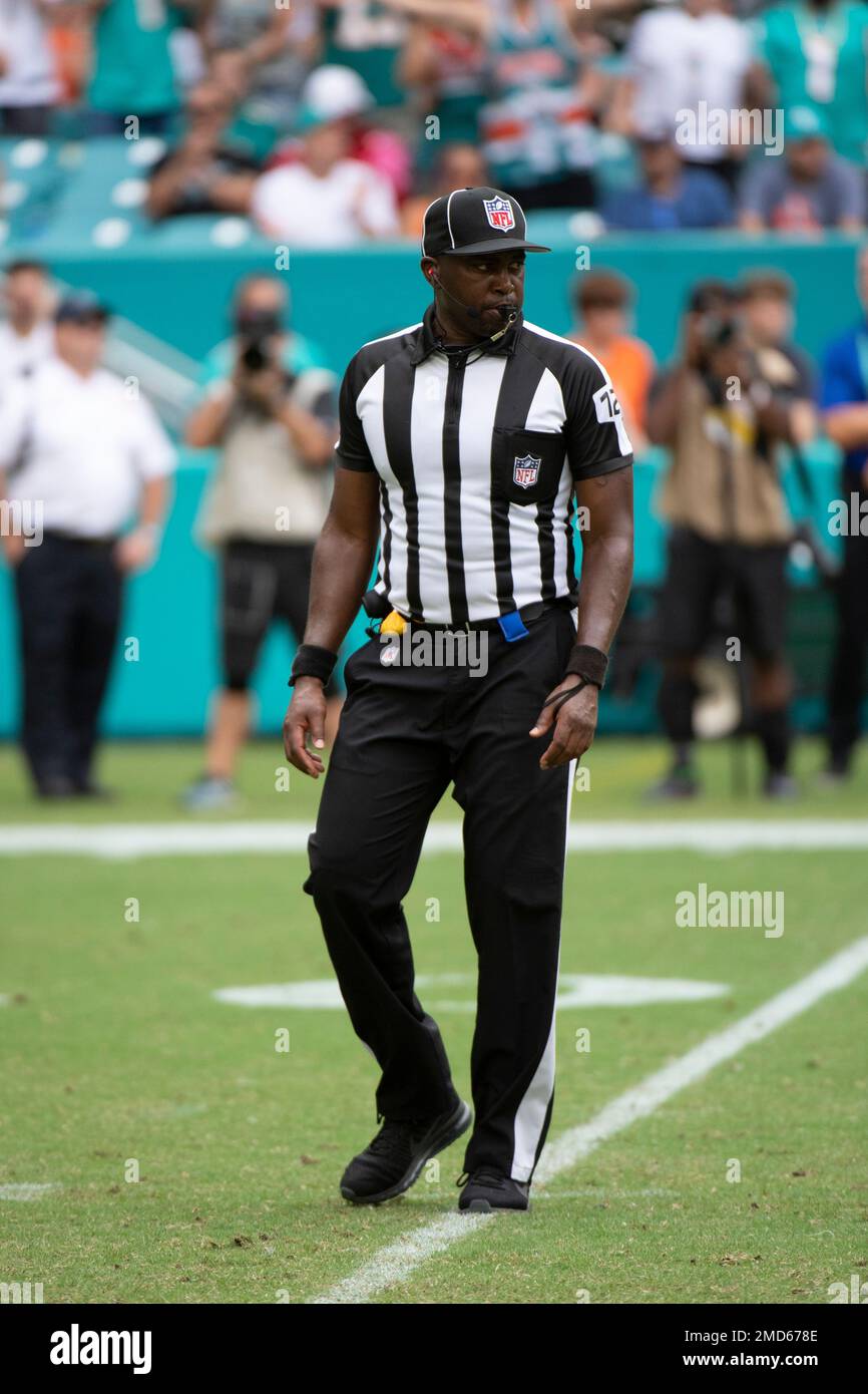 NFL umpire Ramon blows his whistle during an NFL football game