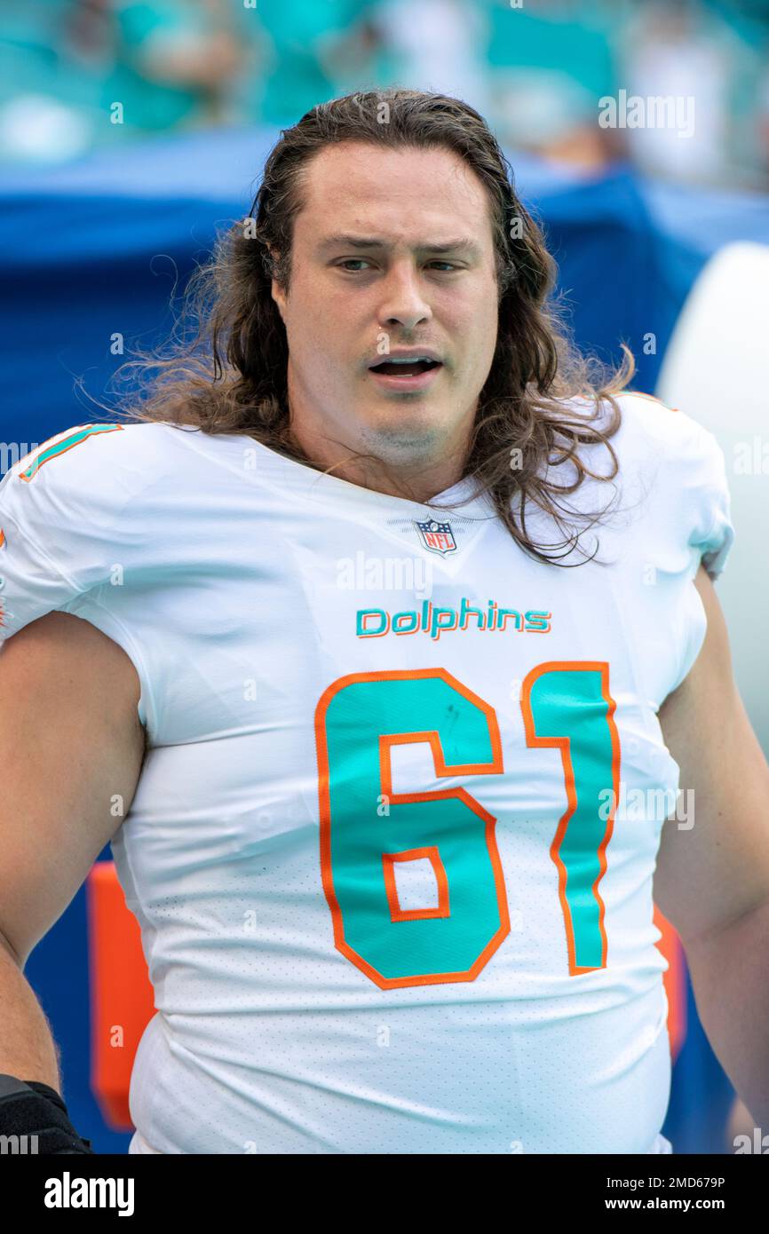 Miami Dolphins center Austin Reiter (61) warms up on the field before the  start of an NFL football game against the Atlanta Falcons, Sunday Oct 24,  2021, in Miami Gardens, Fla. (AP