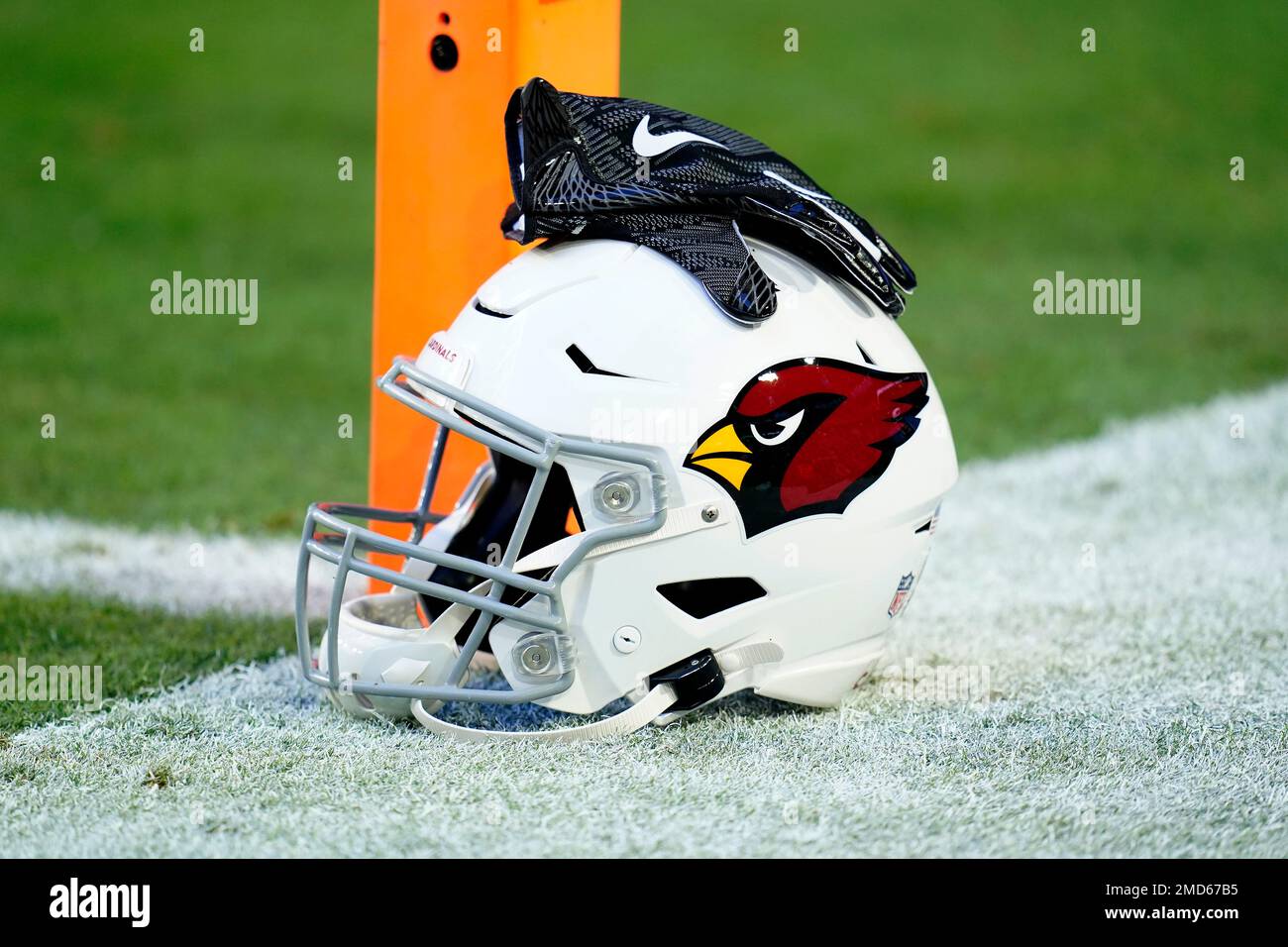 An Arizona Cardinals helmet sits on the sidelines prior to an NFL football  game against the Green Bay Packers, Thursday, Oct. 28, 2021, in Glendale,  Ariz. (AP Photo/Ross D. Franklin Stock Photo 