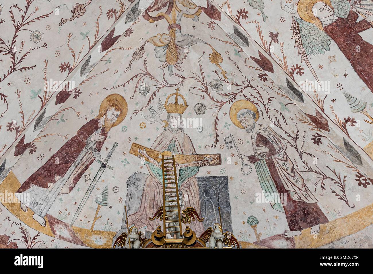 God Father sitting on his throne with st. Peter and st. Paul, an old fresco in Elmelunde church, Denmark, October 10, 2022 Stock Photo