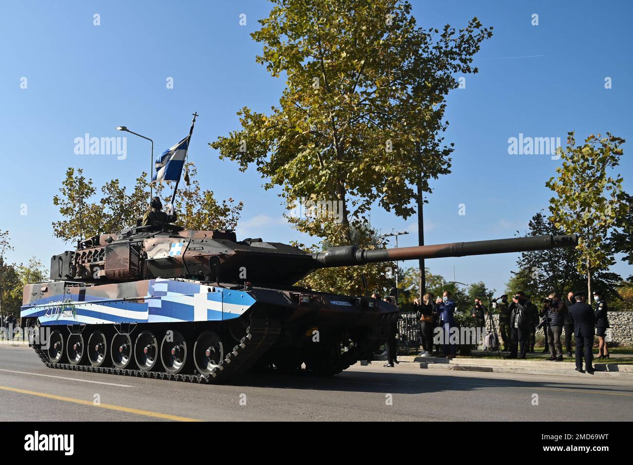 A Tank depicting a paint of a Greek Flag parade through the streets of the northern port city of Thessaloniki, Greece, during a military parade, on Thursday, Oct. 28, 2021. The parade is held to celebrate Greece's refusal to align itself with a belligerent fascist Italy in 1940 and instead fight a much stronger opponent, a decision which dragged it into World War II and eventually led to a brutal occupation by Nazi Germany. (AP Photo/Giannis Papanikos) Stock Photo