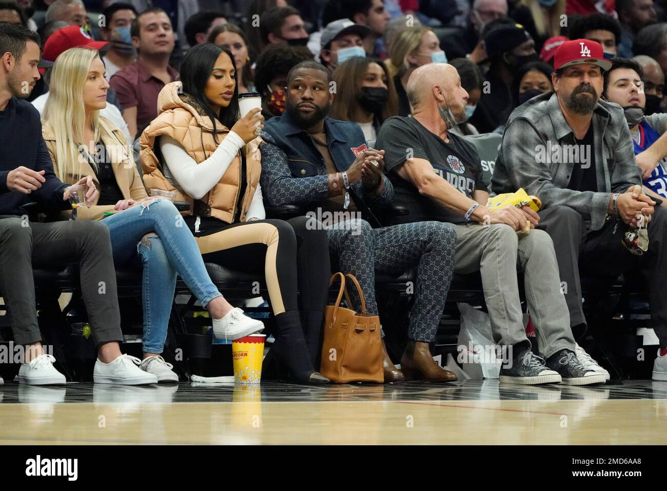 Floyd Mayweather looks downcast while sitting courtside at Los Angeles  Clippers