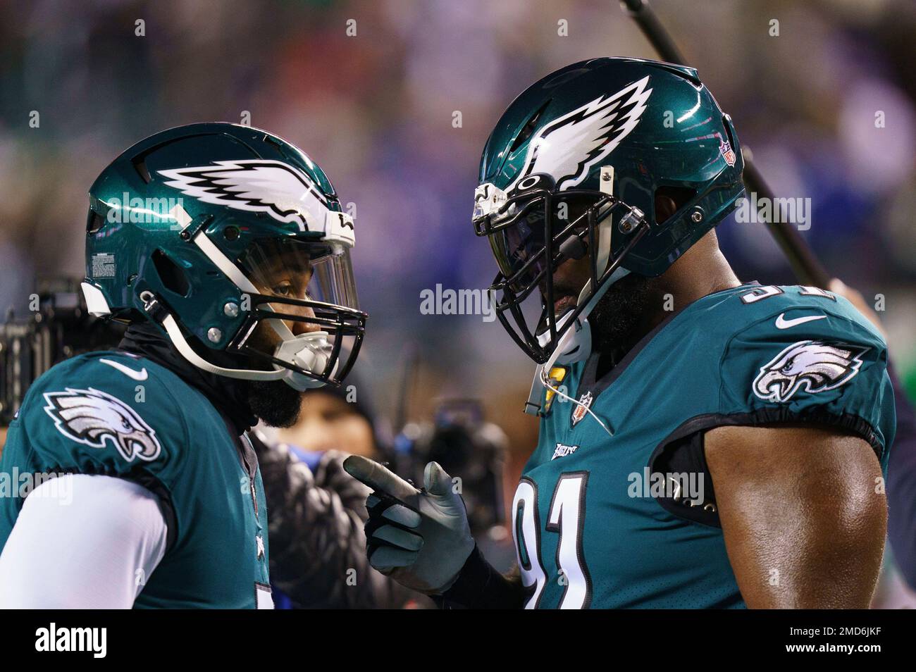 Philadelphia Eagles' Haason Reddick, center, talks with a member