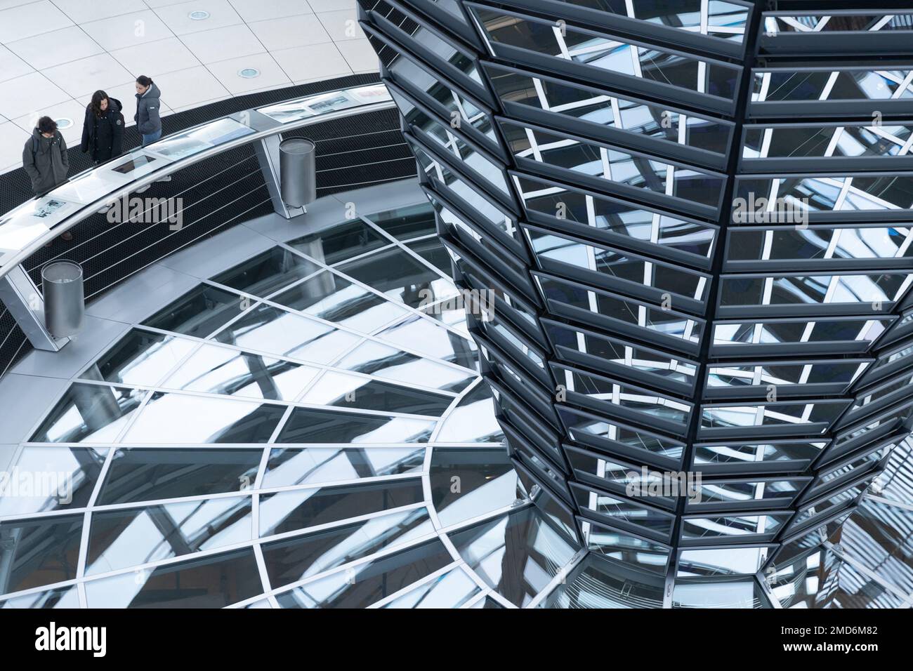 Inside the Bundestag dome. Tourists visit the parliament building of German government. Reichstag new dome interior. Stock Photo