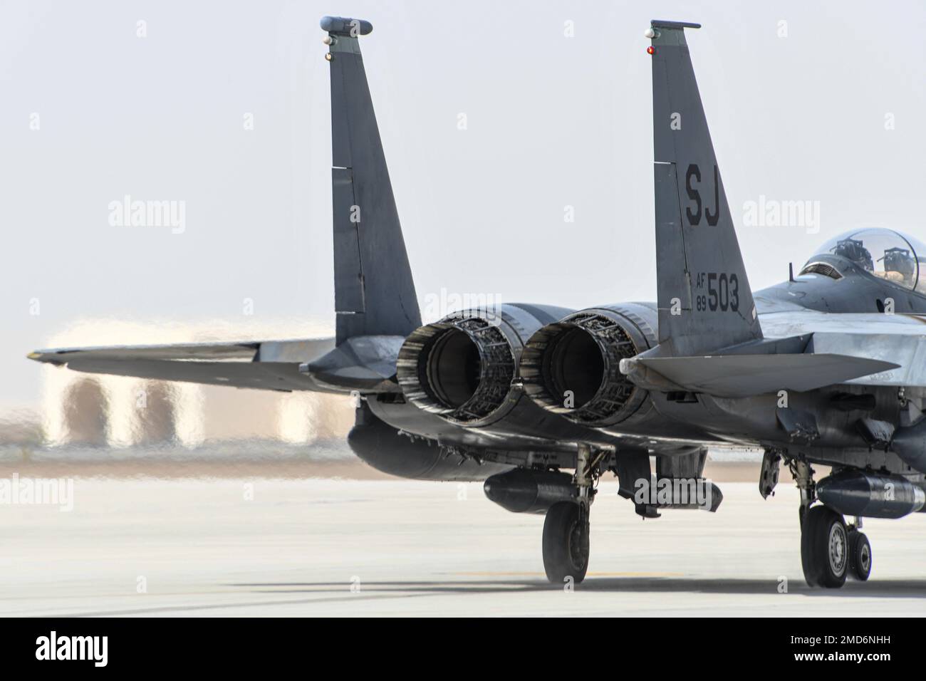 A U.S. Air Force F-15E Strike Eagle taxis to the runway during Agile Combat Employment exercise “Agile Tuskegee” July 12, 2022, at Al Dhafra Air Base, United Arab Emirates. The F-15E can generate 25,000-29,000 pounds of thrust per engine and reach speeds 1,875 mph — Mach 2.5 plus. Stock Photo
