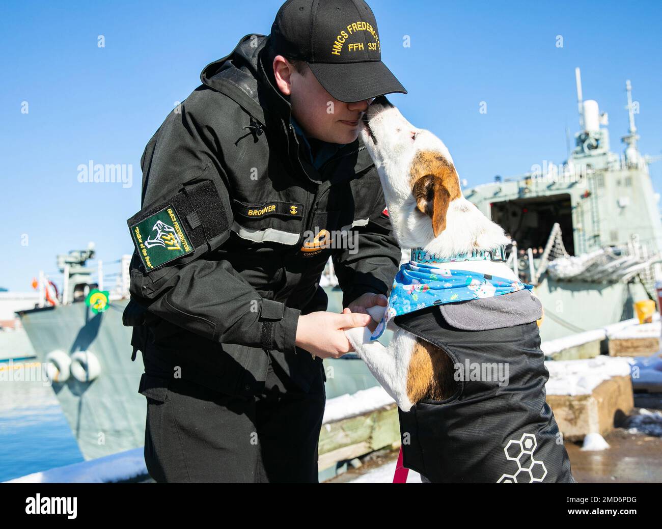 Lieutenant Brouwer says goodbye to his dog Macy as HMCS Fredericton