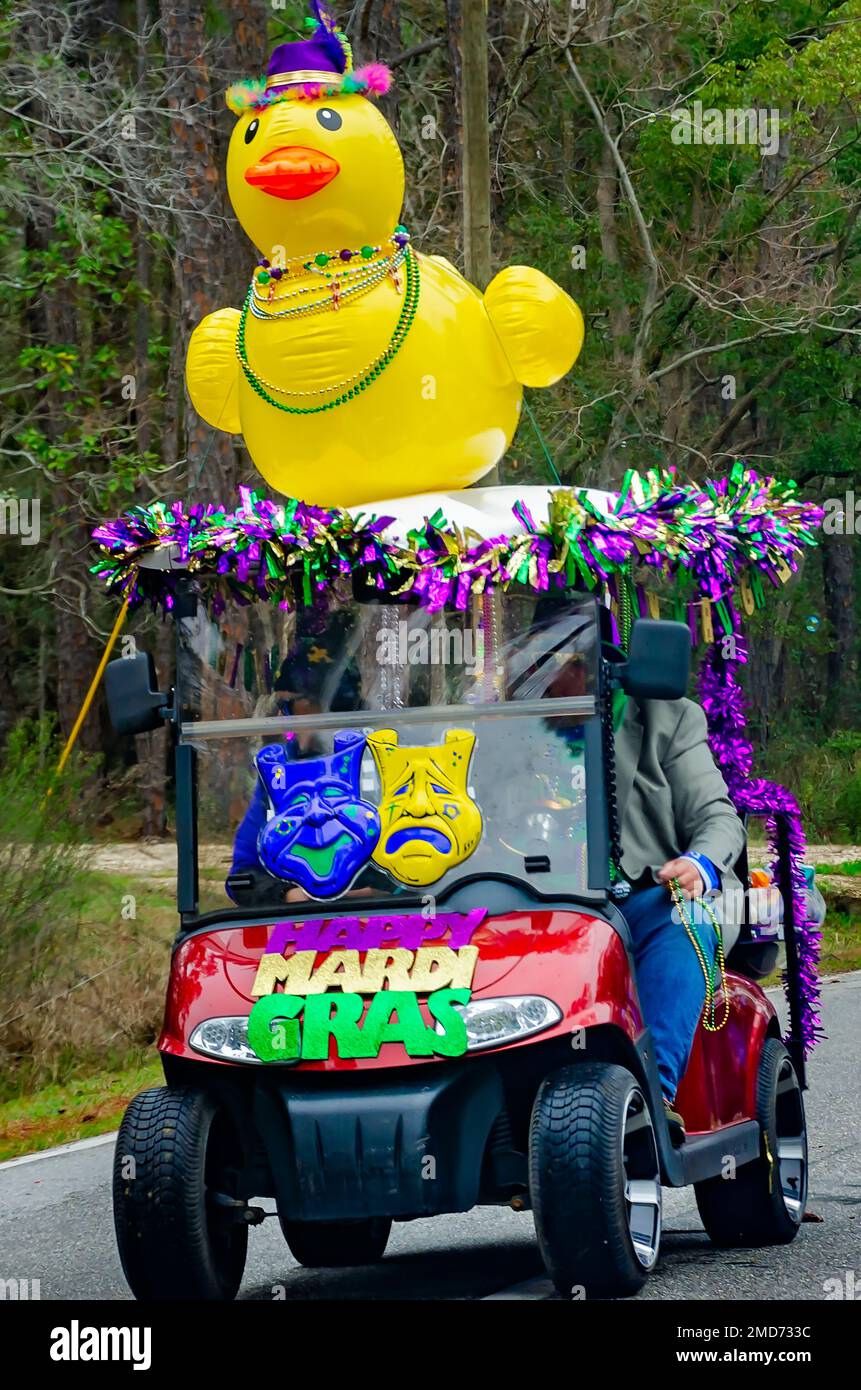 A decorated golf cart participates in the Krewe de la Dauphine Mardi Gras parade, Jan. 21, 2023, in Dauphin Island, Alabama. Stock Photo