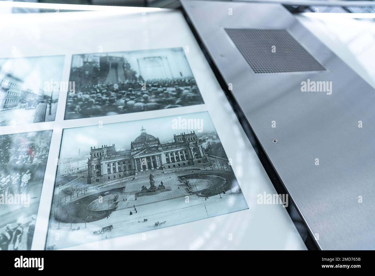 Inside Bundestag dome. Reichstag building in Berlin. Old historical photos and newspaper exhibition inside the dome of german parliament. Stock Photo