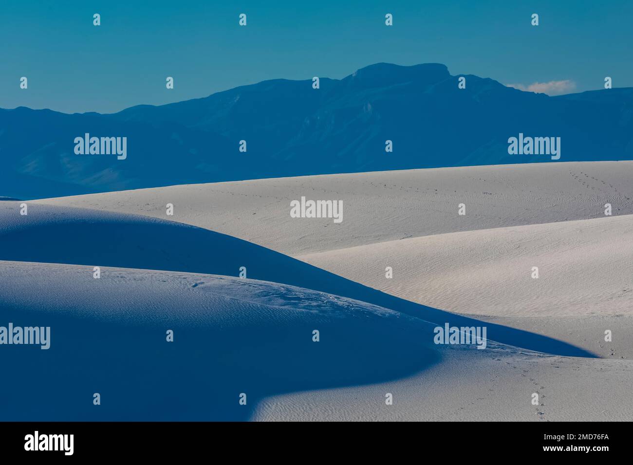 Light and shadow in late afternoon on the gypsum dunes of White Sands ...