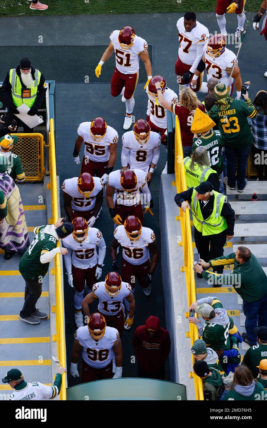 Washington Football Team players walk off Lambeau field before an NFL