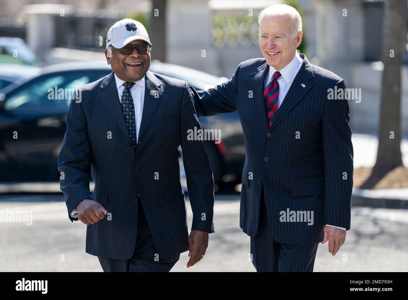 Reportage: President Joe Biden walks across West Executive Avenue with U.S. Representative Jim Clyburn, D-S.C., after signing the Consolidated Appropriations Act of 2022 in the Eisenhower Executive Office Building at the White House, Tuesday, March 15, 2022 Stock Photo