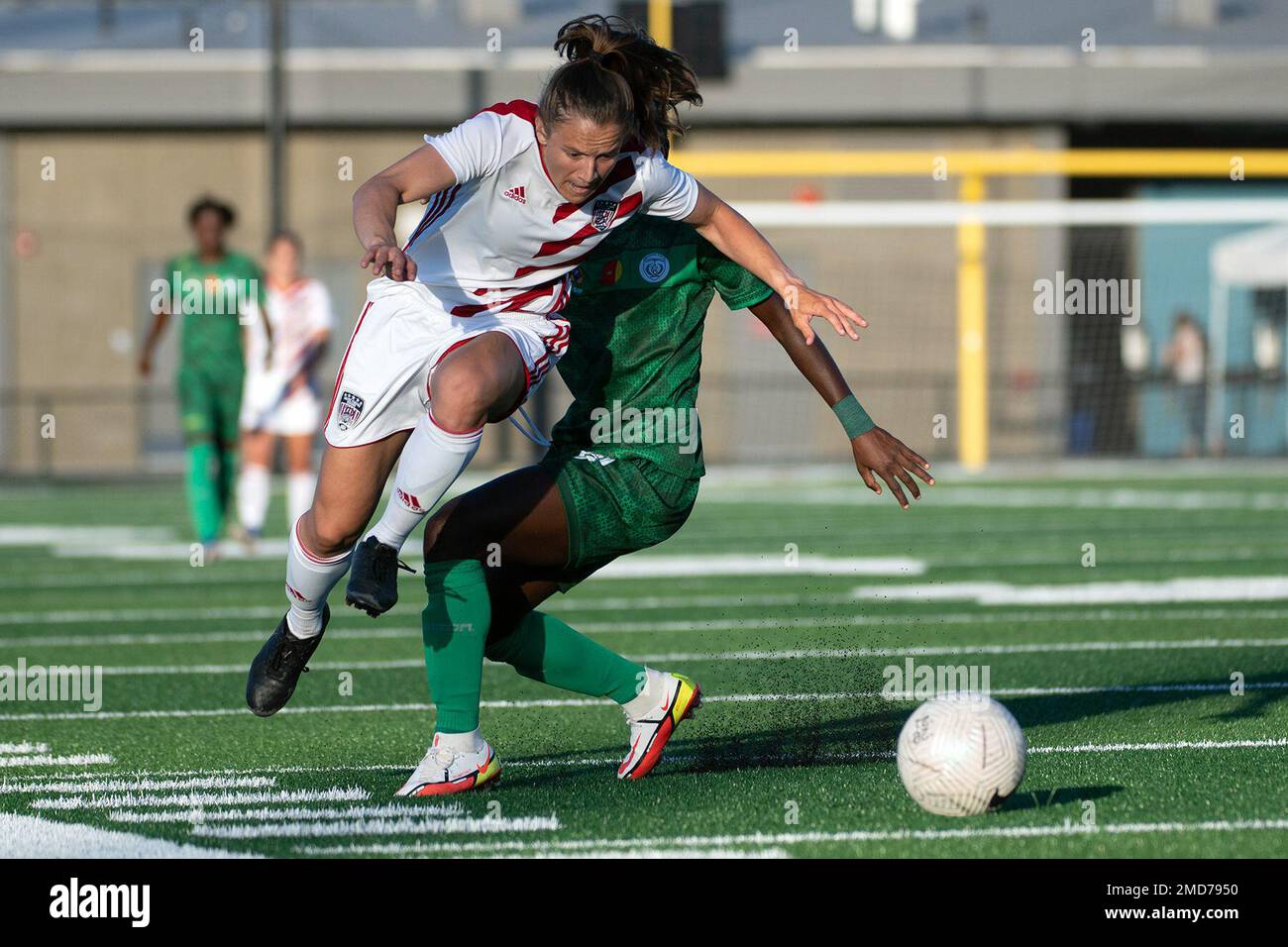 U.S. Army Capt. Kailey Utley leaps past a Cameroon player during the 2