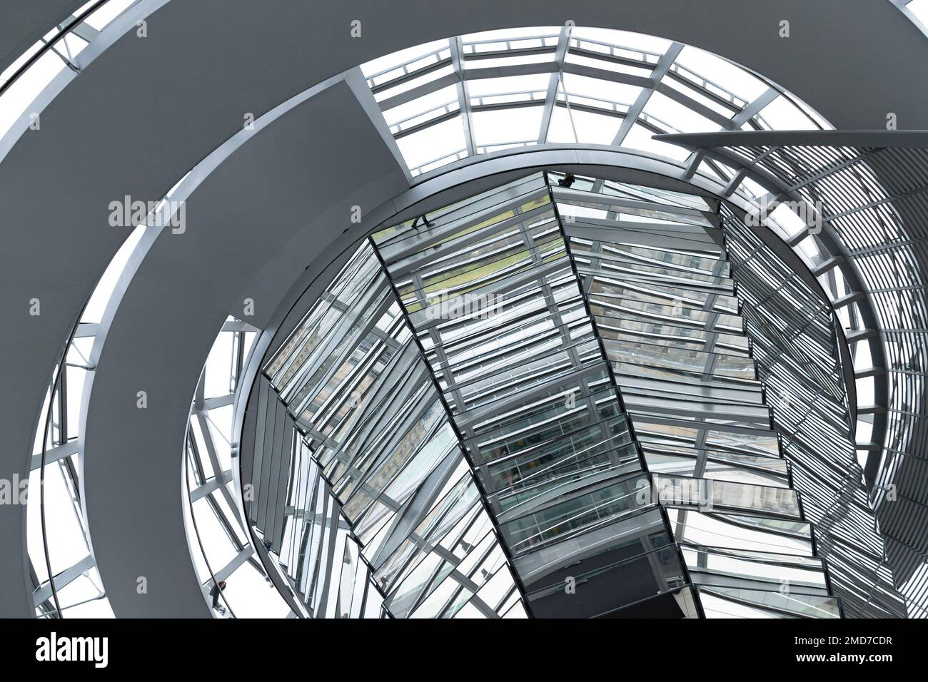Inside the Bundestag dome. Tourists visit the parliament building of German government. Reichstag new dome interior. Stock Photo