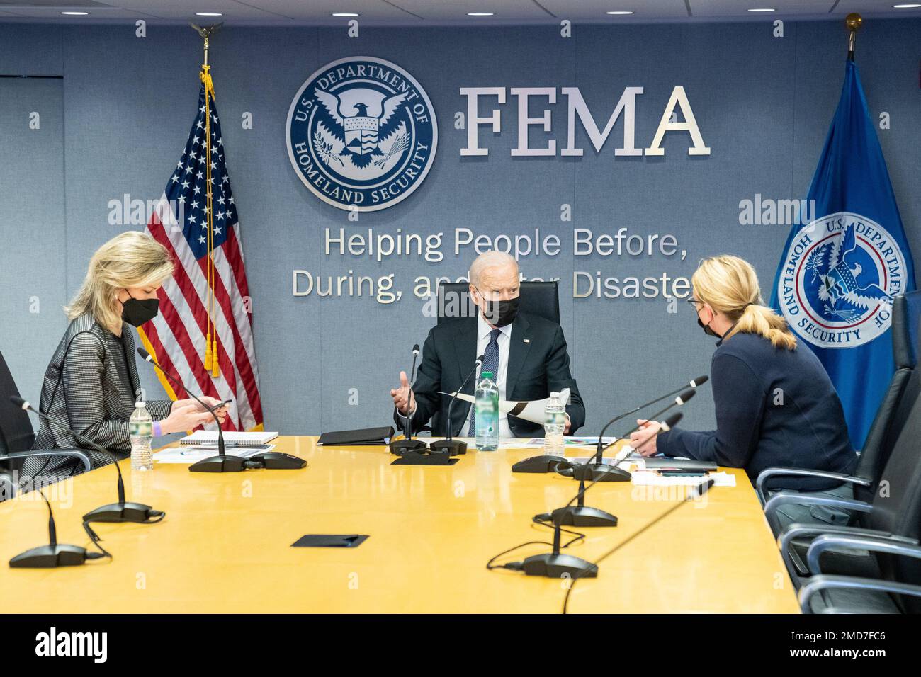 Reportage: President Joe Biden, joined by Federal Emergency Management Agency (FEMA) Administrator Deanne Criswell, right, and Deputy National Security Adviser Liz Sherwood-Randall, receives an update briefing on Hurricane Ida, Sunday, Aug. 29, 2021, at the FEMA Headquarters Stock Photo