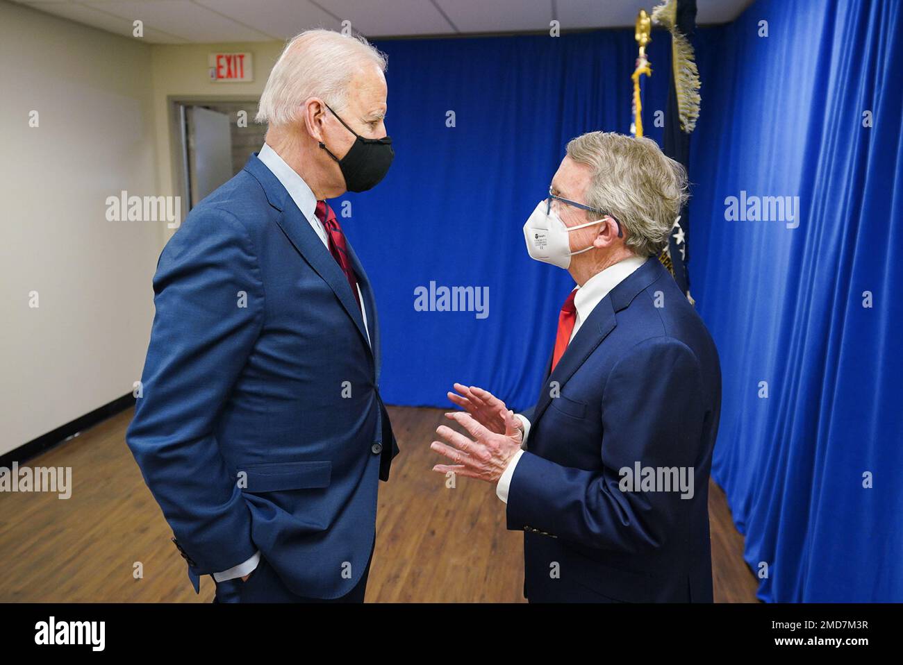 Reportage: President Joe Biden talks with Ohio Gov. Mike DeWine (R) Tuesday, March 23, 2021, at John Glenn Columbus International Airport in Columbus, Ohio Stock Photo