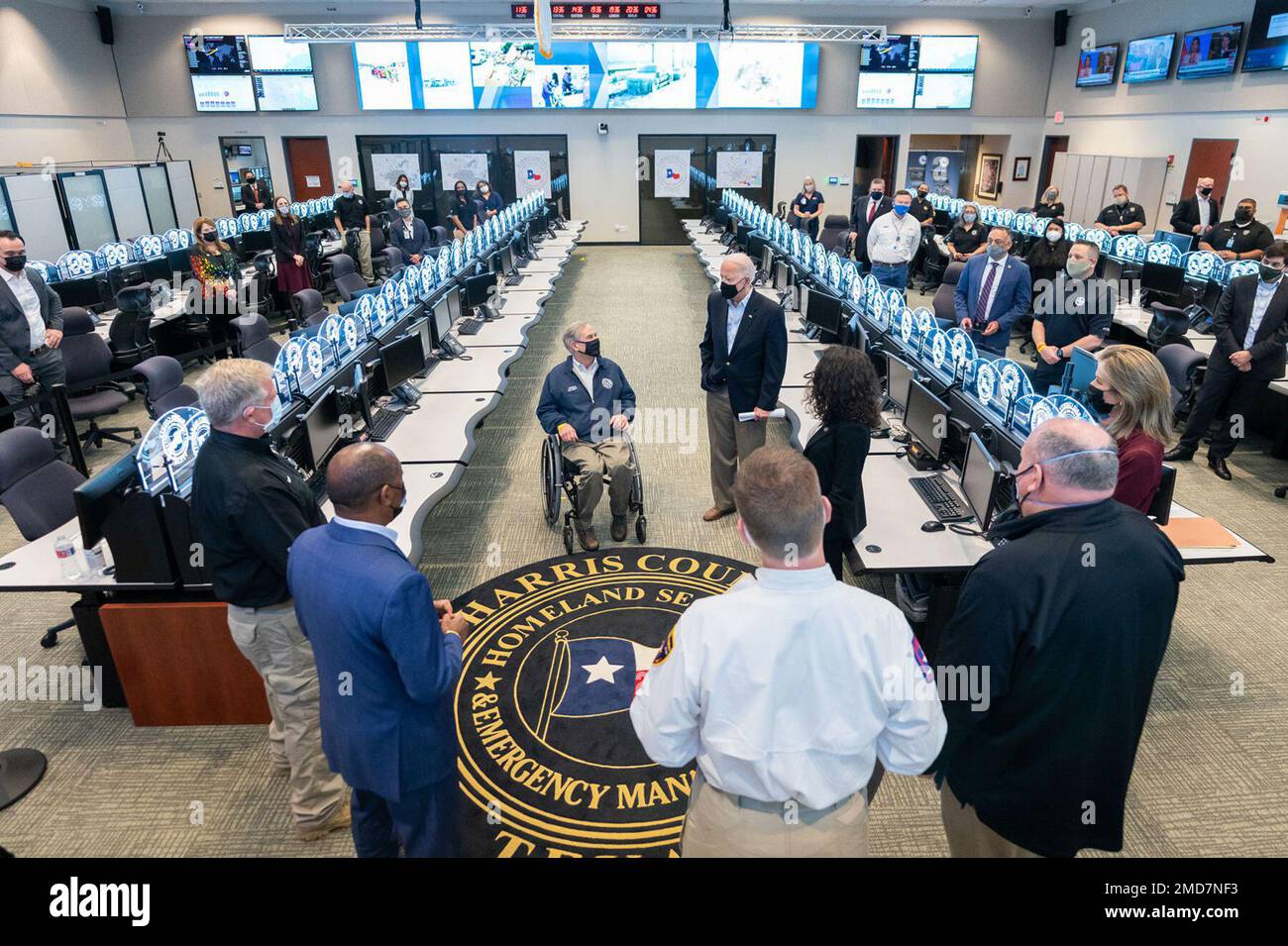 Reportage: President Joe Biden talks with Texas Gov. Greg Abbott, Texas legislators, and emergency Operations Center staff Friday, Feb. 26, 2021, after receiving a briefing at the Harris County Emergency Operations Center in Houston. Stock Photo
