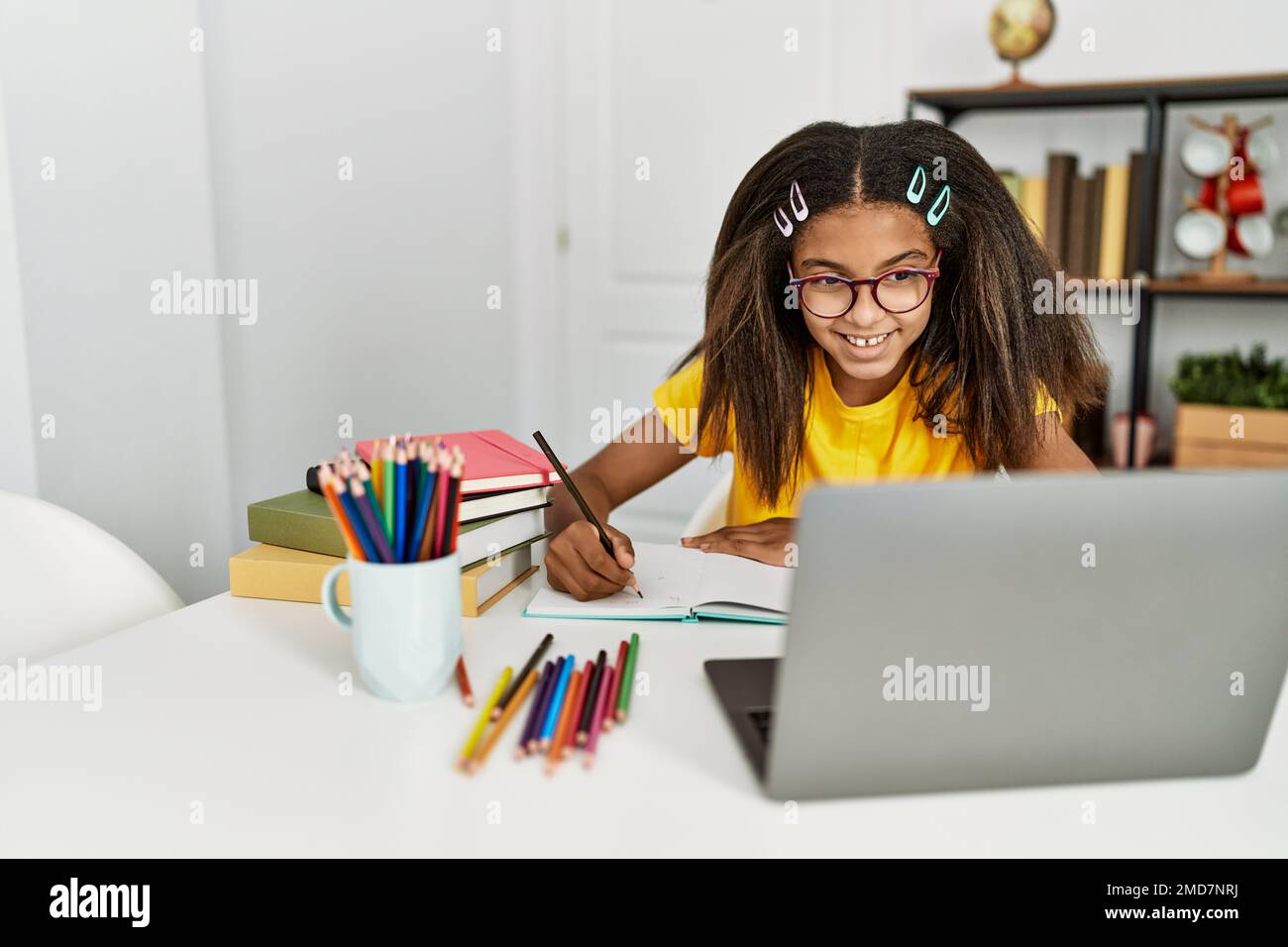 African american girl smiling confident doing school homework at home ...